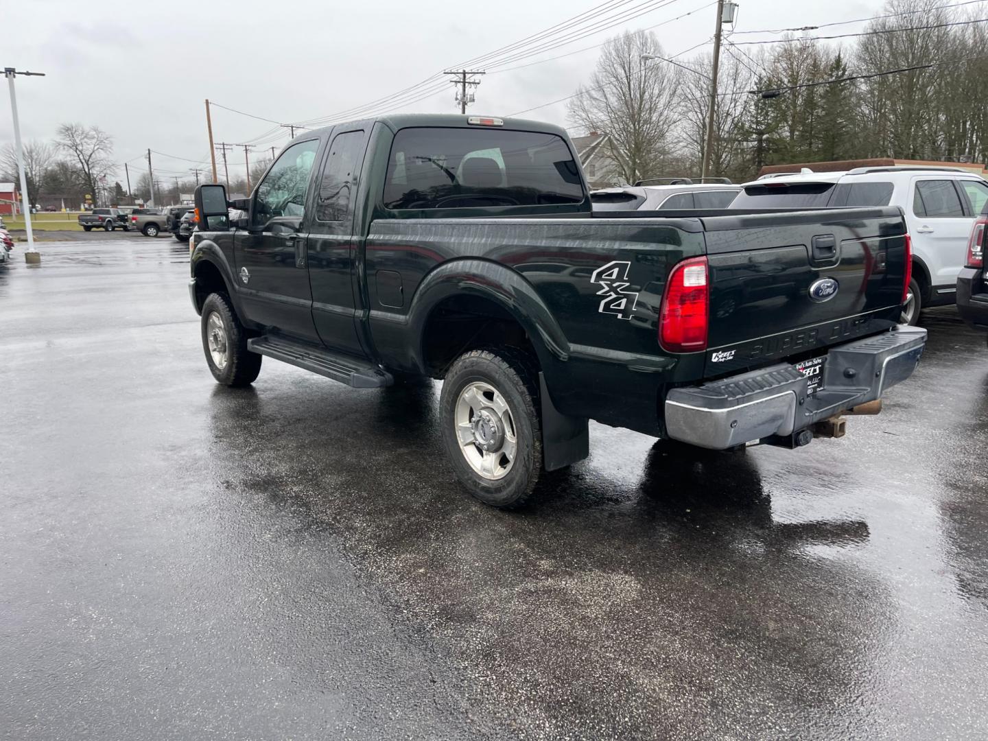 2015 Green /Gray Ford F-250 SD XLT SuperCab Long Bed 4WD (1FT7X2BT6FE) with an 6.7L V8 OHV 16V DIESEL engine, 6-Speed Automatic transmission, located at 547 E. Main St., Orwell, OH, 44076, (440) 437-5893, 41.535435, -80.847855 - Photo#13